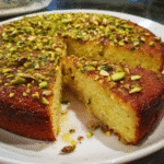 Pistachio Ricotta Cake – Moist, Easy & Beautifully Nutty 9 Slice of pistachio ricotta cake on a white plate