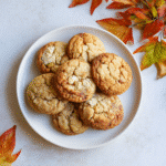 Apple Cider Cheesecake Cookies with Spiced Sugar 7 Apple Cider Cheesecake Cookies on a plate with visible cheesecake filling.