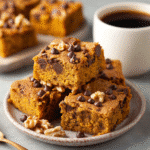 Easy Homemade Pumpkin Maple Blondies You’ll Love 7 Pumpkin Maple Blondies on a plate with coffee.