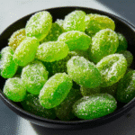 Tasty Frozen Grapes with Citrus 7 Frozen grapes with citrus slices in a bowl, a refreshing snack option.
