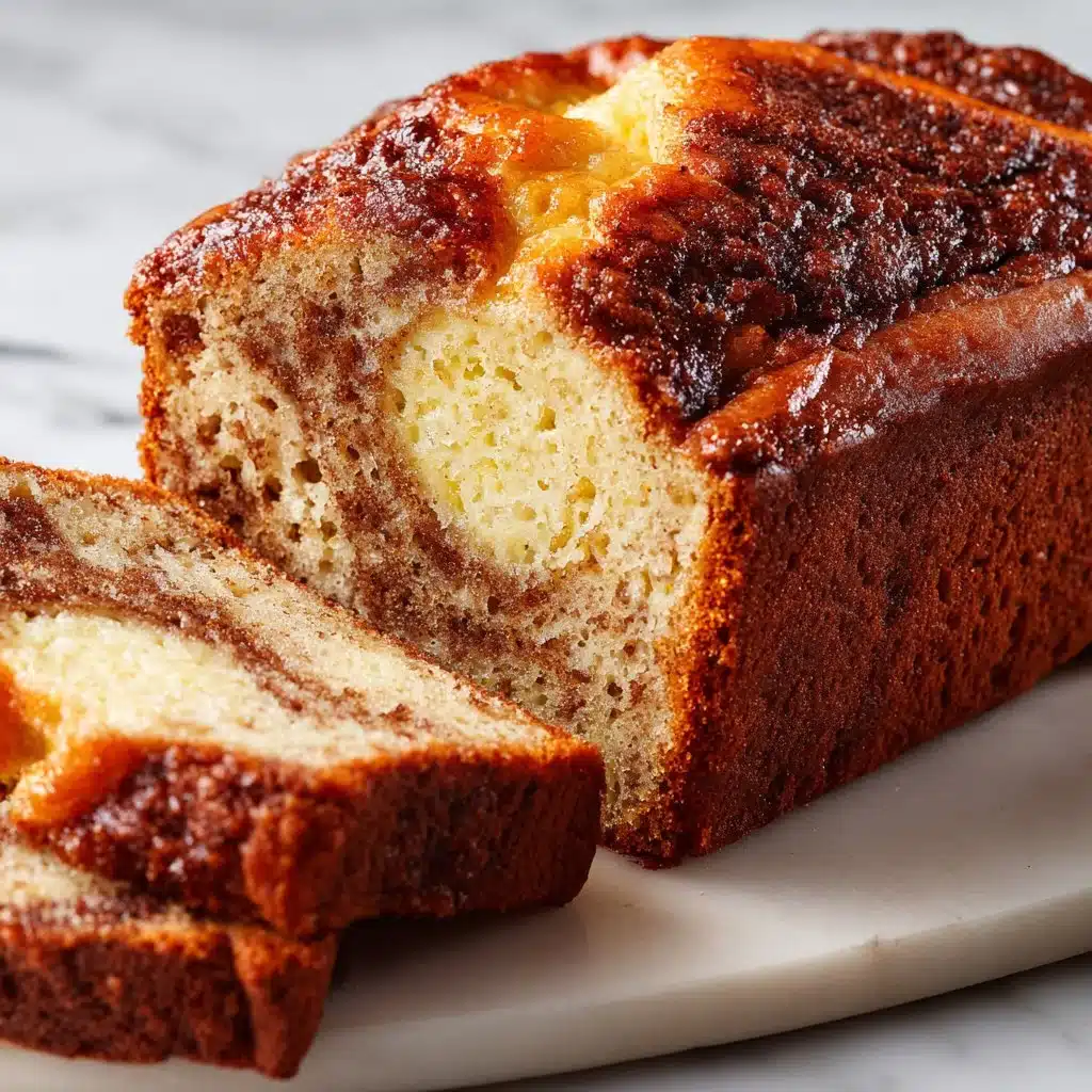 Easy Cinnamon Swirl Banana Bread | Cozy Homemade Recipe 6 Loaf of cinnamon swirl banana bread with a golden crust and moist texture