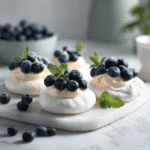 Easy Meringues with Citrus Curd Recipe | Elegant Gluten-Free Treat 7 Delicious meringues topped with vibrant citrus curd for a refreshing dessert