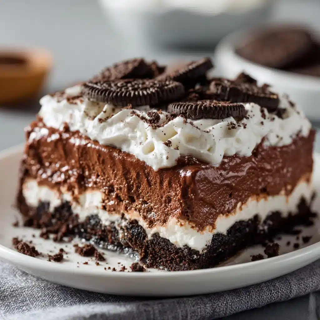 Indulge in Layered No-Bake Oreo Dessert Today! 3 Delicious layered no-bake Oreo dessert with cream and crushed cookies