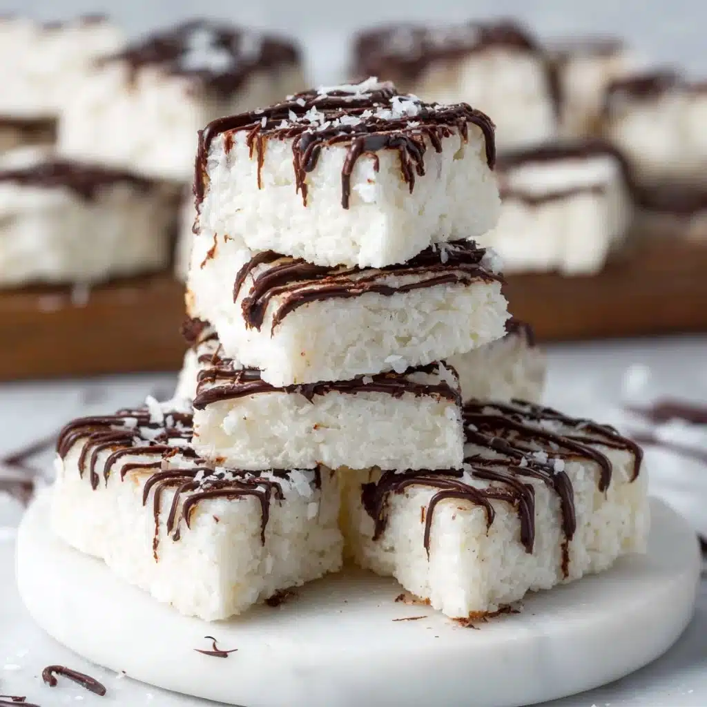 Easy No Bake Keto Coconut Bars for Sweet Cravings 3 No bake keto coconut bars on a white plate, showcasing their delicious texture.