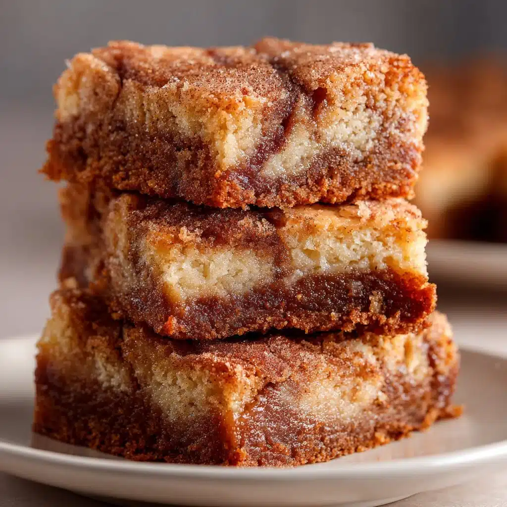 Delicious cinnamon swirl snickerdoodle blondies freshly baked and cut into squares.