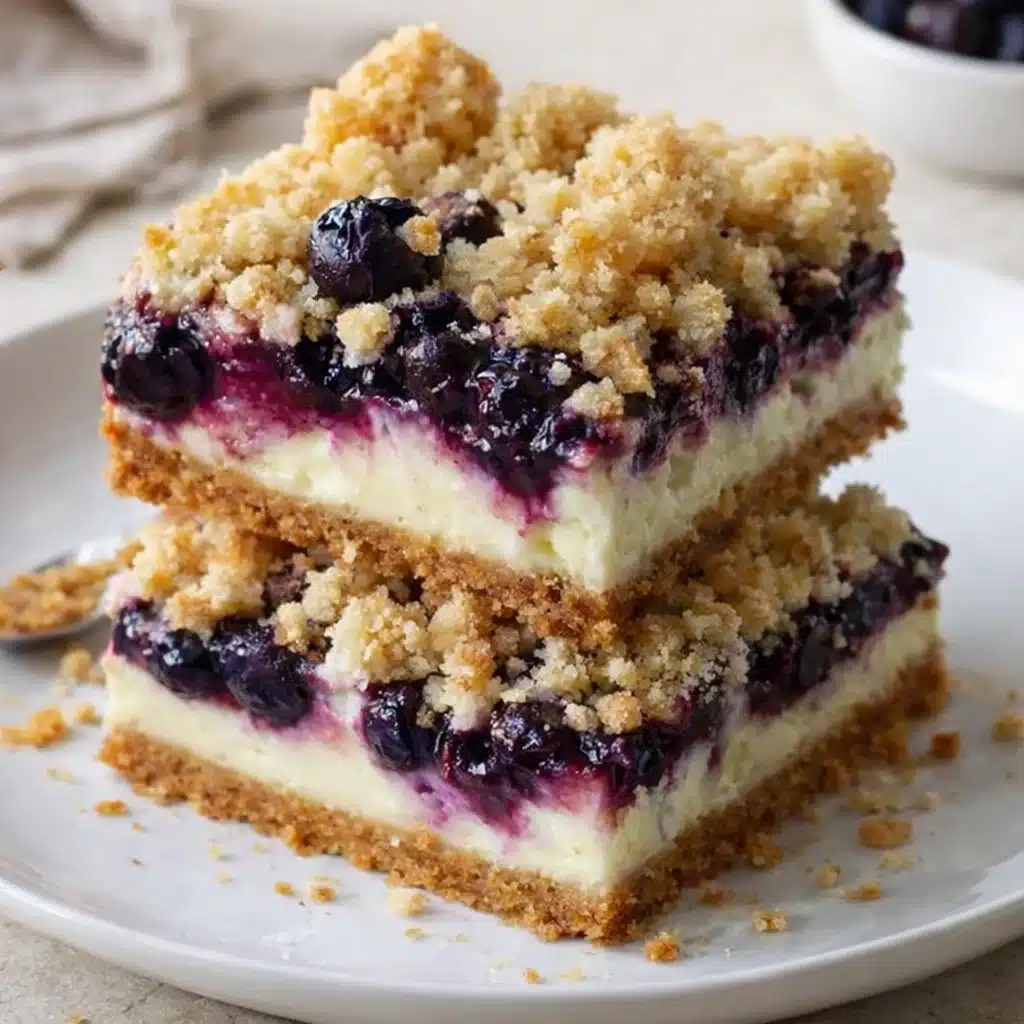 Blueberry Crumble Cheesecake Bars 3 Delicious blueberry crumble cheesecake bars on a serving platter