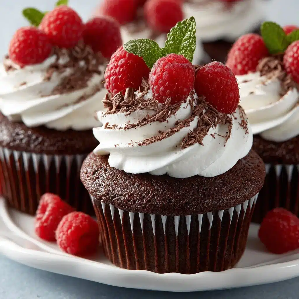Delicious Chocolate Raspberry Cupcakes topped with fresh raspberries